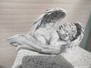 Angelot endormi dans ses ailes 