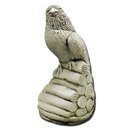 Statue épervier sur tas de bois regard à gauche