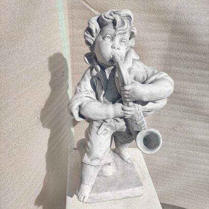Statue garçon joueur de Saxo