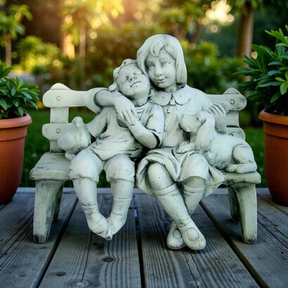 Statue Frére et soeur assis sur un Banc