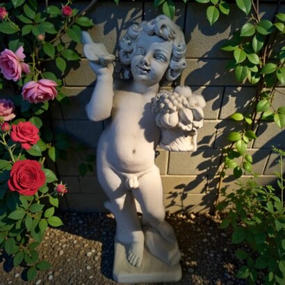 Statue garçon automne panier de fruits