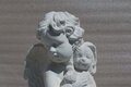 Statue Angelot et sa peluche